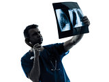 doctor surgeon radiologist on the phone examaning lung torso  x-
