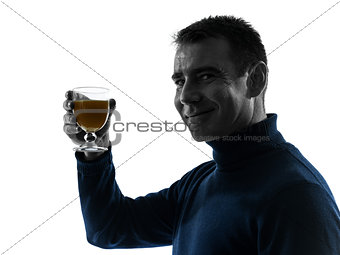 man drinking orange juice silhouette portrait