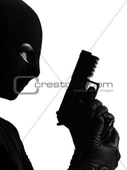thief criminal terrorist holding gun portrait