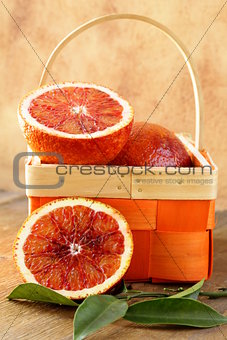 red (bloody) oranges  on a wooden background