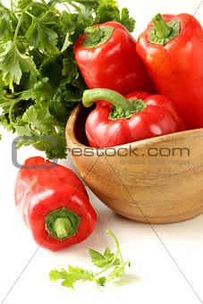 Fresh ripe red bell paprika peppers and parsley