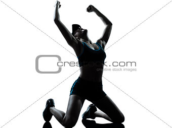 woman runner jogger kneeling winner victory