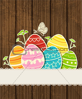 Wooden background with Easter eggs 
