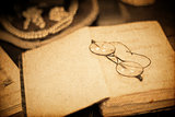 Vintage book and glasses. Closeup shot, retro styled.