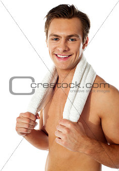 Sexy attractive male with towel around his neck