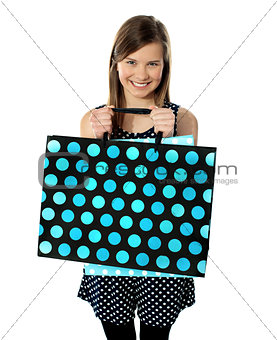 Teenager holding shopping bags
