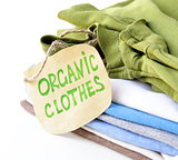 stack of multicolored clothing with organic label