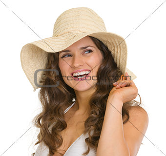 Portrait of happy young woman in hat