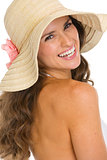 Portrait of smiling young woman in hat