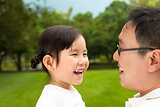 happy asian little girl with her father 