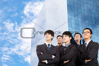 young business team standing before the modern building