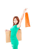 happy young asian woman holding shopping bag