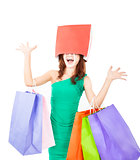 excited young woman with shopping bag on the head