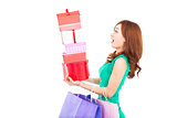  surprised young woman holding gift box and shopping bag