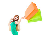 happy young woman holding shopping bag