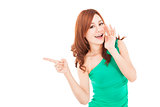 smiling asian young woman shouting and pointing 