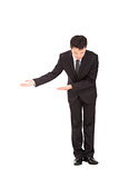 full length of asian businessman with bow and welcome gesture