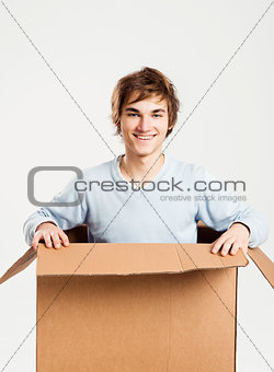 Man inside a card box