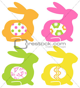 Colorful easter bunnies with eggs isolated on white