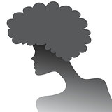 silhouette of a girl with lush hair in profile