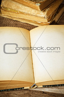 open old book on a wooden surface 
