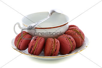 Macaroons and white cup.