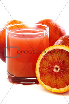 Glass with juice and blood oranges.