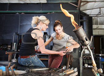 Workers Cleaning Hot Tools