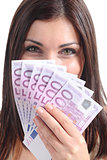 Beautiful woman smiling and holding a lot of five hundred euro banknotes
