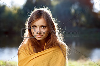 young beautiful woman wrapped herself up in a scarf