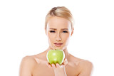 Happy and healthy woman holding apple