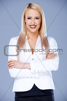 Smiling business woman posing with arms crossed