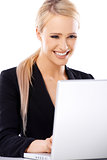 Adorable blond business woman working on laptop