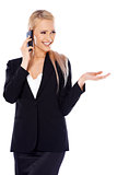 Happy blond business woman using her mobile