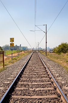 Indian railroad track through coutryside