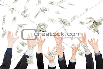 Many dollars falling on business people hand 