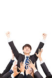 young businessman with success gesture and group of support hand