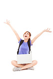 happy young Woman sitting with laptop and looking up