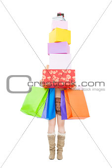 young woman holding gift box and shopping bag