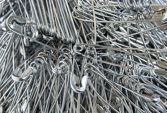Safety pins pile closeup