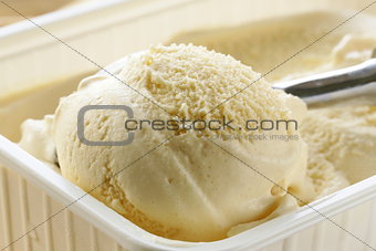 creamy vanilla ice cream in a white cup