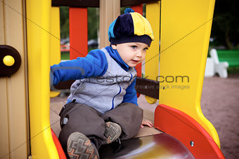 Boy Playing on Playground
