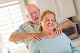 Senior Adult Husband Giving Wife a Shoulder Rub