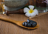 hot stone massage with spa treatment items on the background