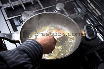 making sauce in a pan
