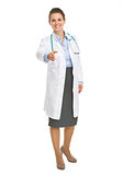 Happy medical doctor woman stretching hand for handshake