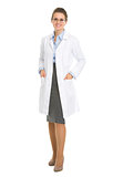 Full length portrait of smiling ophthalmologist doctor woman in 