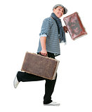 Happy running traveller with vintage suitcases
