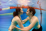 man and girl in swimming pool