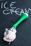 Strawberry ice cream and scoop